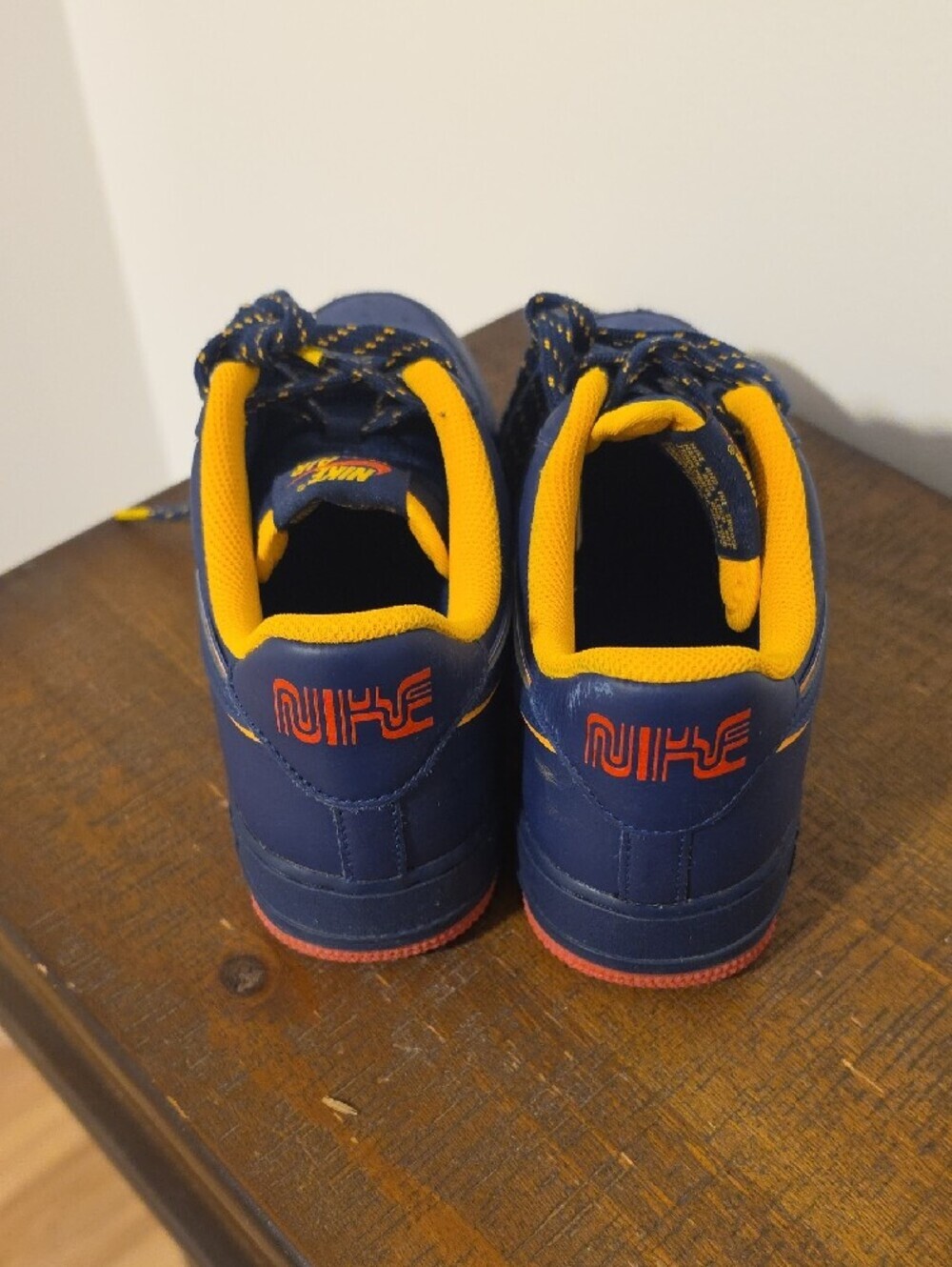 Nike Kids Navy Sneakers with Yellow Lining and Red Soles - Picture 3 of 5